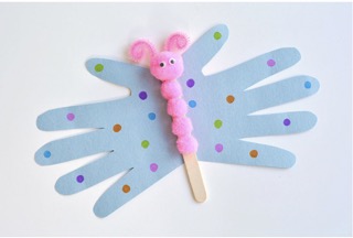 Blue, pink, and green handprint butterfly with pink pom poms glued on a popsicle stick for the body.