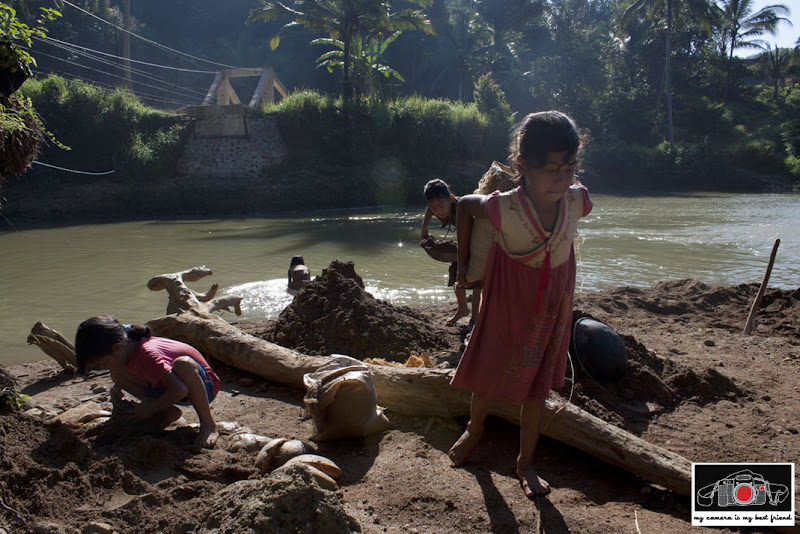 Girls collecting sand