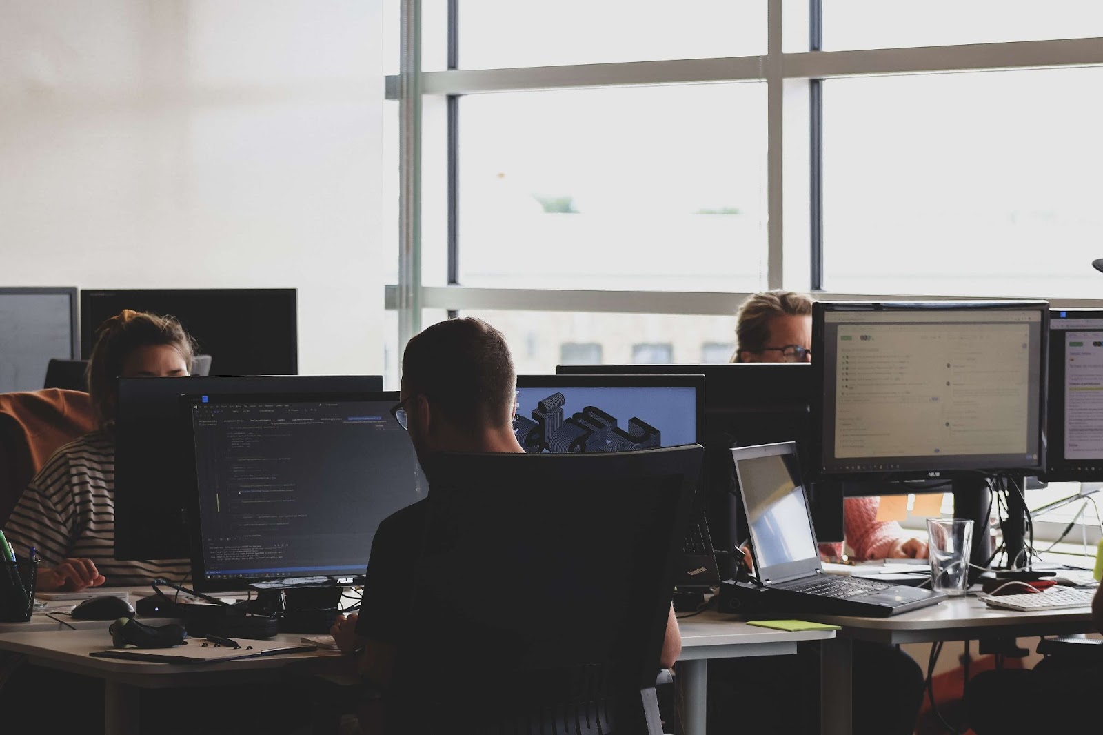 developers working together in a room with big windows