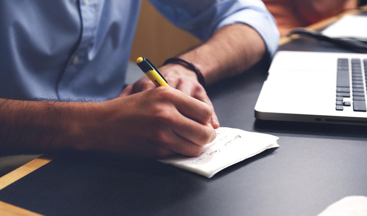 Person making notes on paper