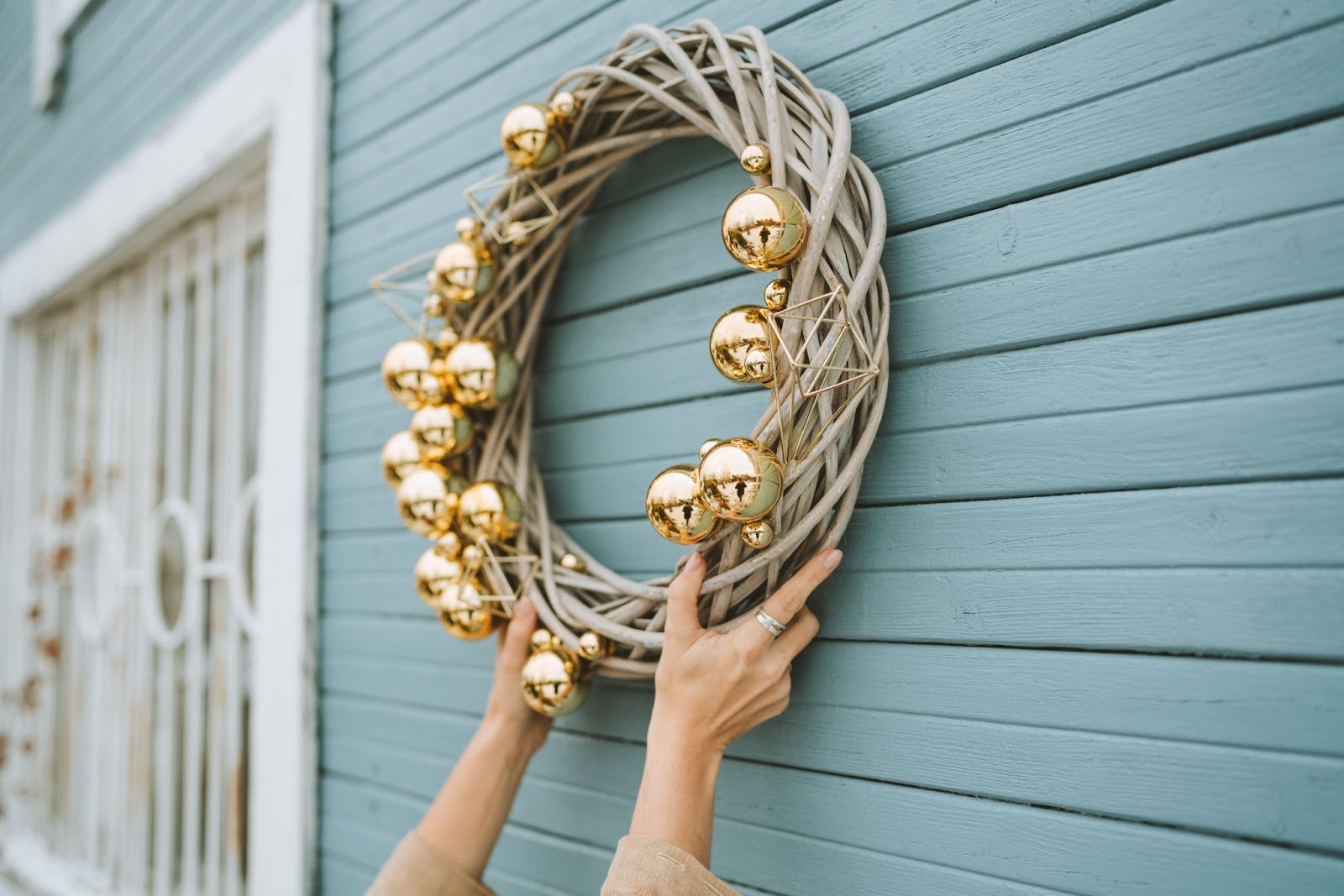 hanging a Christmas wreath