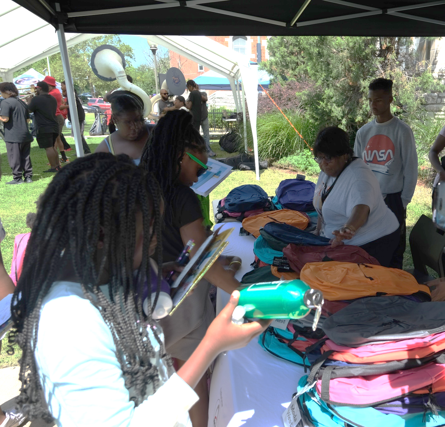 Some students receiving their free backpacks at the BFL Back To School Festival 2023.