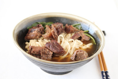 beef noodle soup with chopsticks