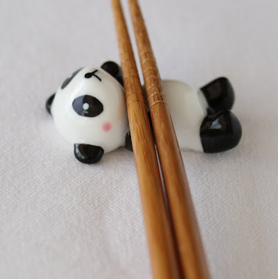 photo of chopsticks in a panda bear shaped holder