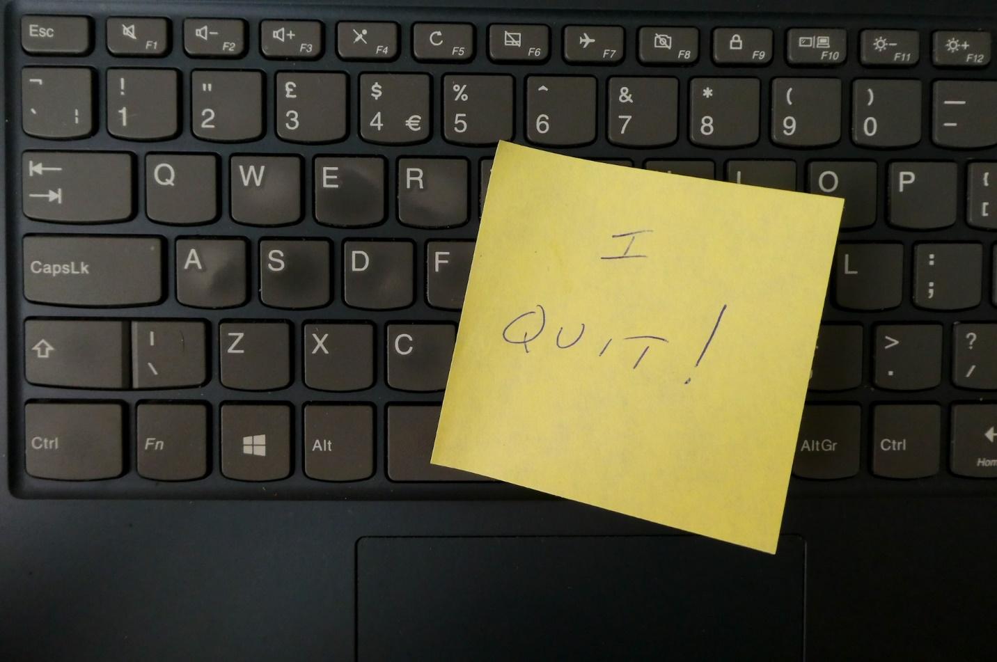 A don't quit sticker on keyboard