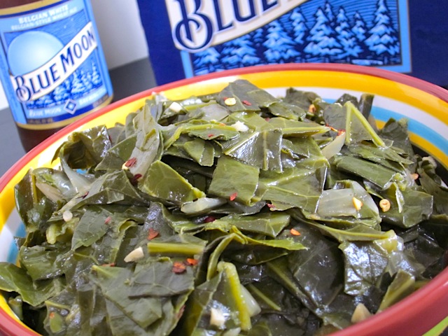 beer braised collard greens on plate with blue moon in background 
