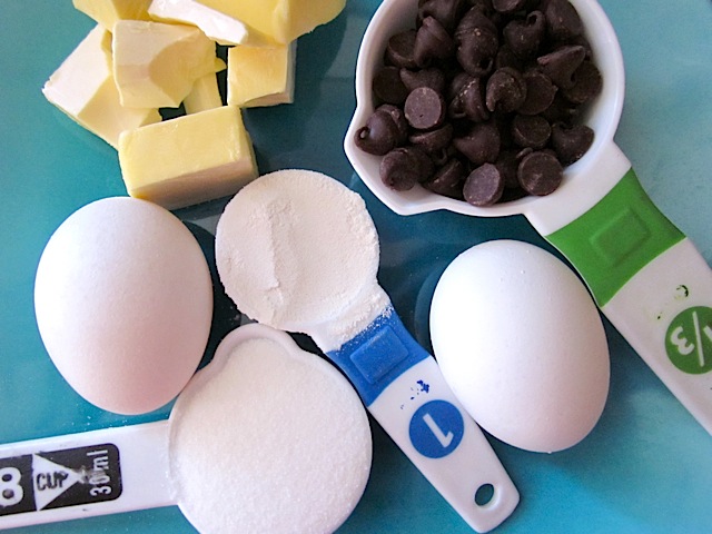 ingredients (eggs, sugar, chocolate chips, butter, flour)