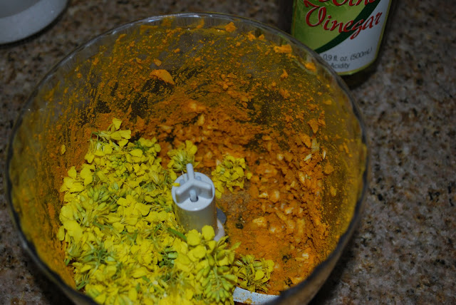 Food processor 2 This is a photo of mustard flowers in a food processor with spices.