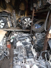 Engines for various 4x4s including, back central bottom, the famous 1KZ-TE powering our little jaunt. There's a second just out of view to the left, and two cylinder head assemblies on the shelf.