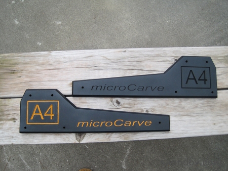 microCarve A4 CNC side panels, one is as original, one has the logo painted in with Harvest Gold paint.