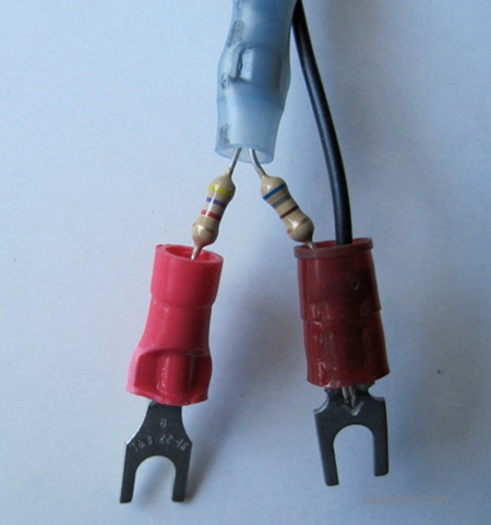 A pair of resistors on spade lugs, 4700 and 690 ohms.