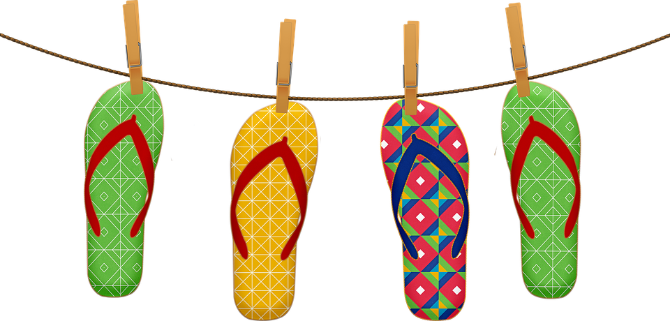 Flip flops hanging on a close line