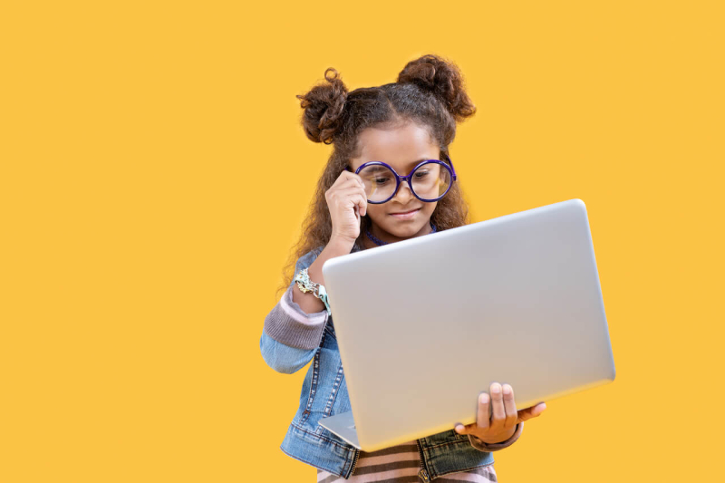 A child debugging code on a computer screen
