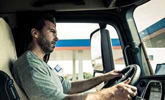 The profile of a semi-truck driver.