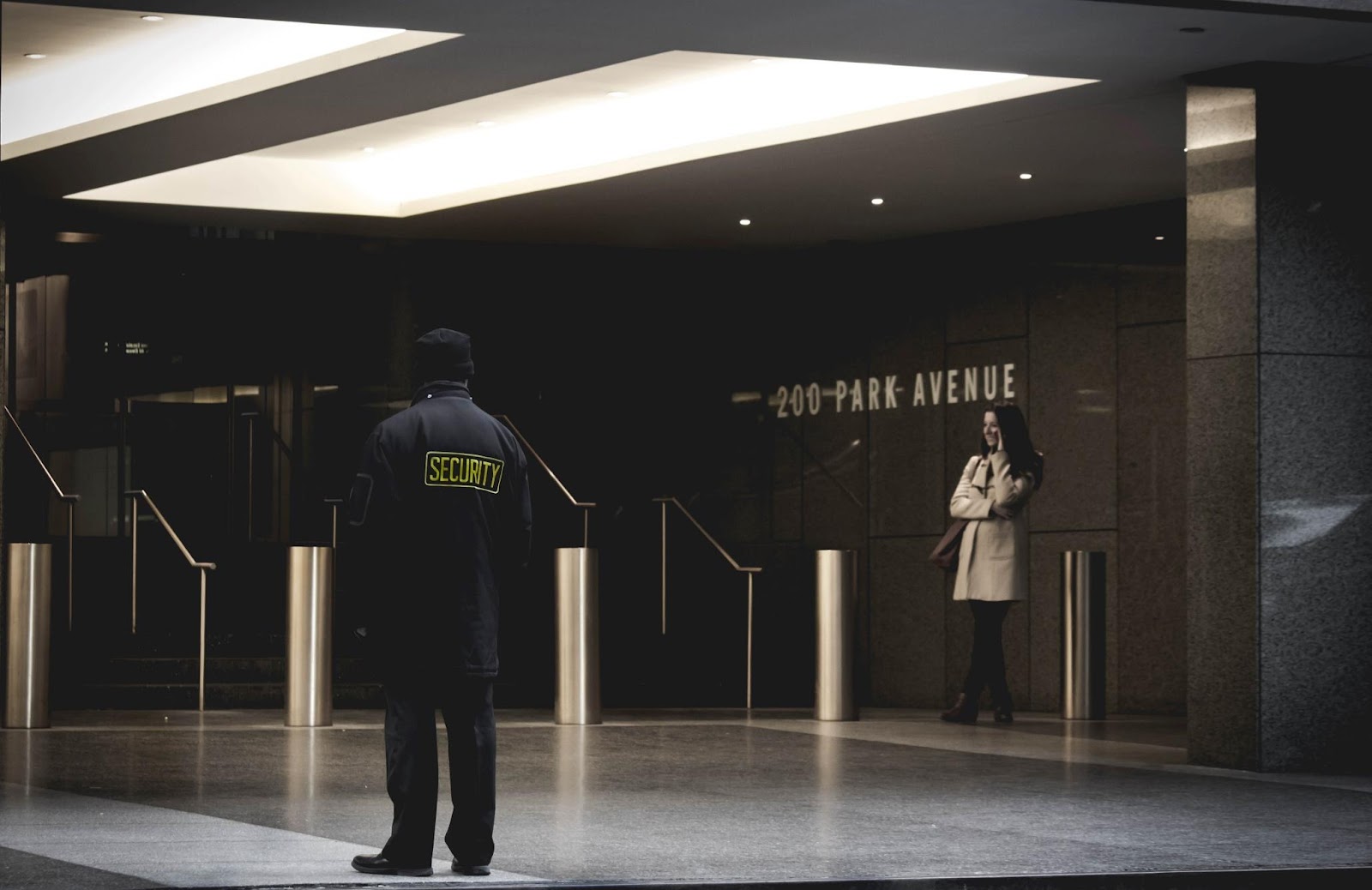 Security Guard standing on the Gray Floor | Photo by Collin Armstrong from unsplash.com
