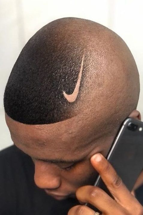 a man wearing southside fade with the Nike logo design