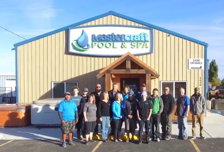 The Mastercraft Pool & Spa family stands in front of our store ready to help you choose the best inground pool for your family.