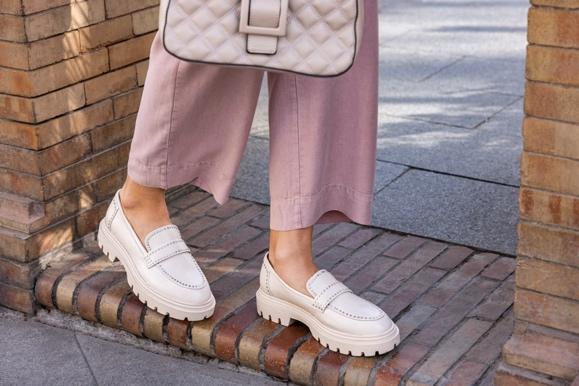 A person's legs and shoes

Description automatically generated with low confidence