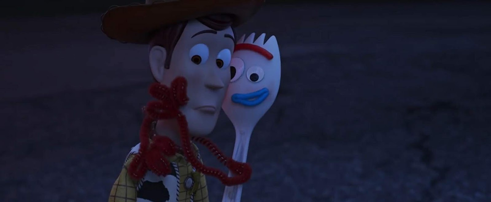 Movie still from Toy Story 4 with Tom Hanks as Woody and Tony Hale as Forky