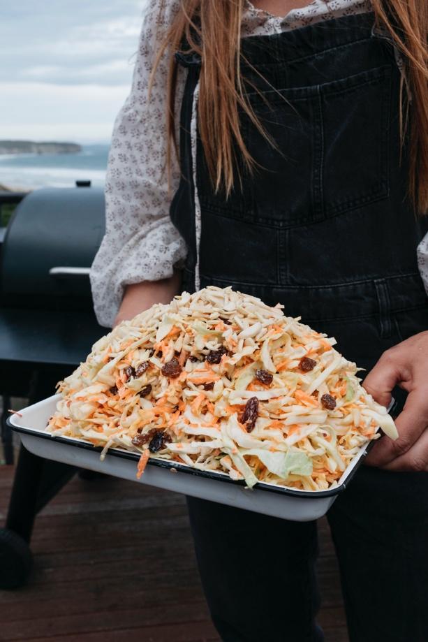 A person holding a tray of food

Description automatically generated with medium confidence