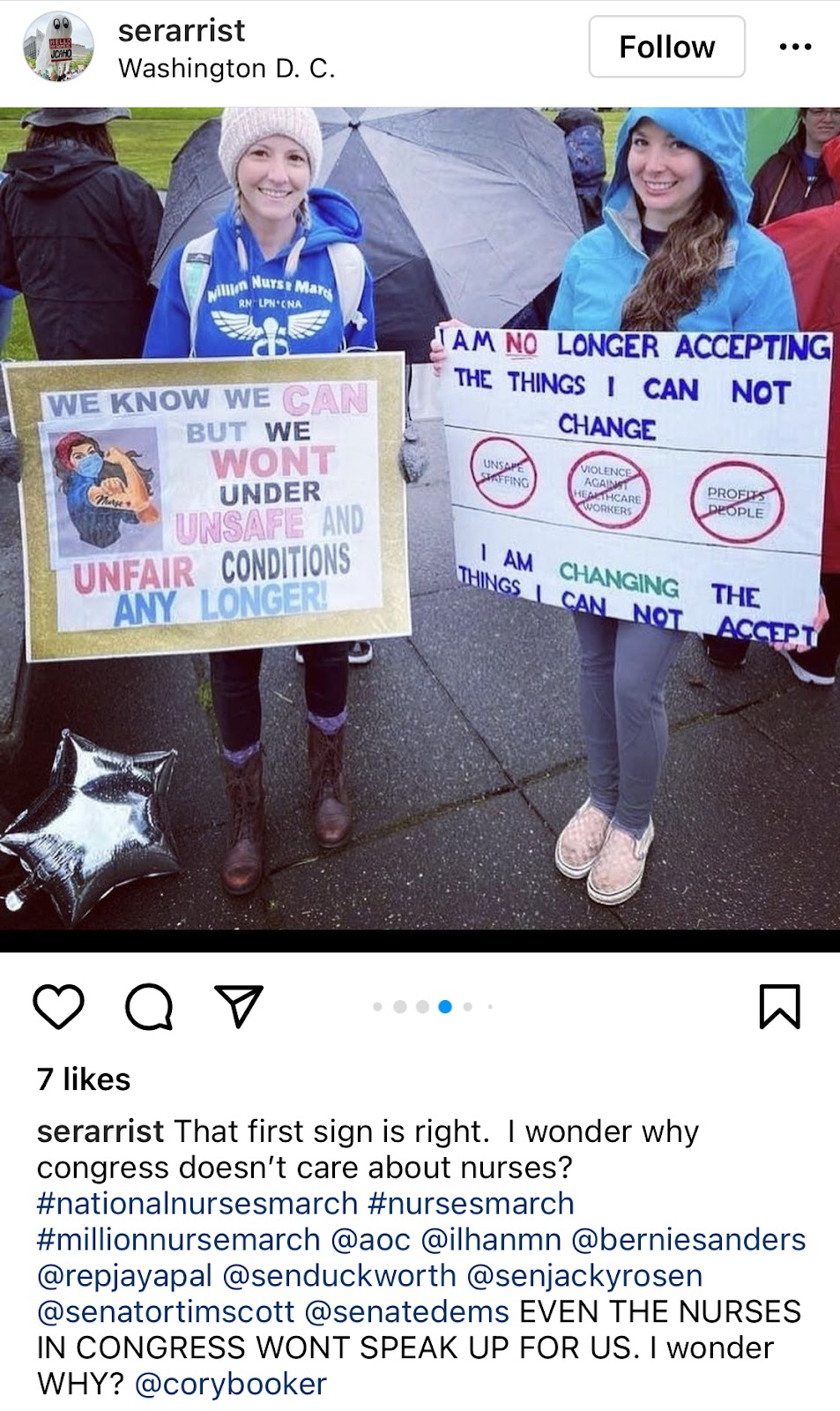 Two girls posing with signs mentioning unsafe working conditions.