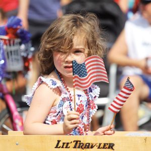 Image of a kid in the July 4th Pet Parade in Bend, Oregon.