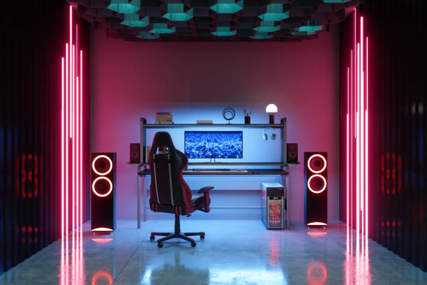 Gaming Room At Night With Neon Light. Gaming Chair And Speakers In The Room. Gaming Room At Night With Neon Light. Gaming Chair And Speakers In The Room. gaming chair stock pictures, royalty-free photos & images