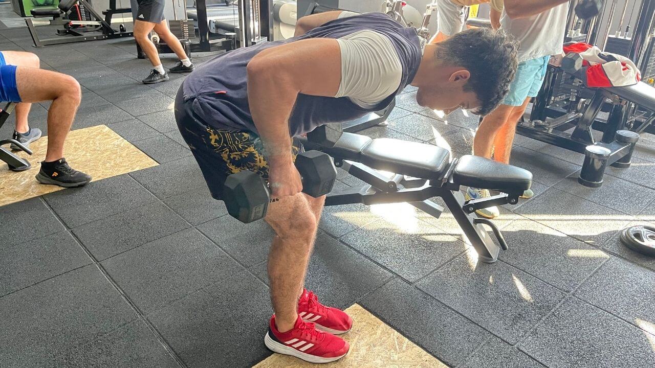 Vanja performs bent-over dumbbell rows.