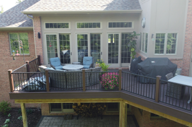 raised composite decking costs deck with furniture and seating custom built lansing michigan