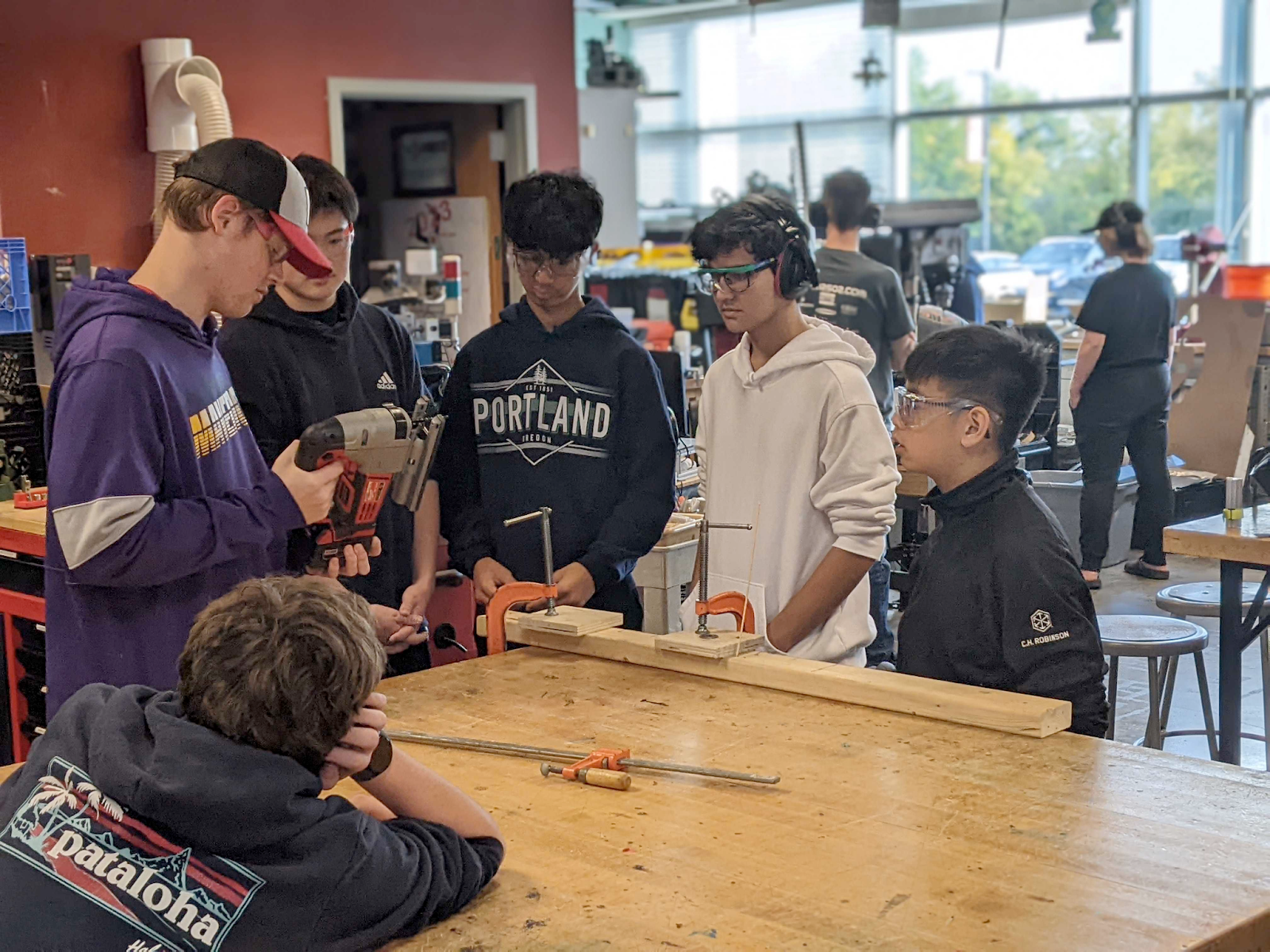 six students getting taught about the jigsaw.