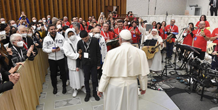 Pope Francis with a pilgrimage group from the Seraphic Institute of Assisi at the Vatican on Monday (CNS/Vatican Media)