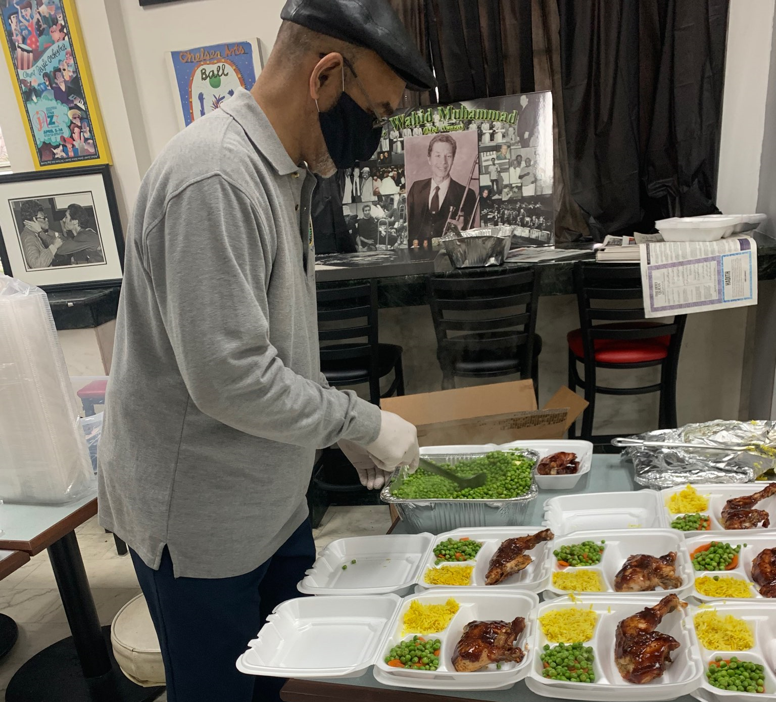 Image of man serving food at the Muslim Center