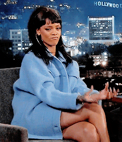Gif of Rihanna doing the "Pay Me" gesture.