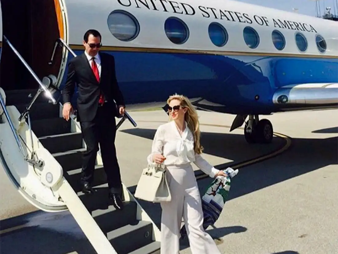 Treasury Secretary Steven Mnuchin and his wife, Louise Linton, step off a private plane at Fort Knox.