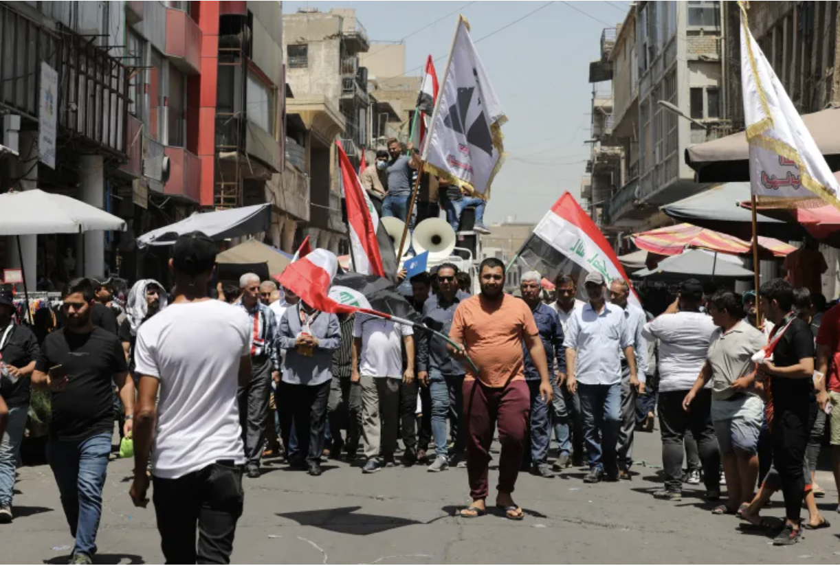 Protesters gather in front of the Iraqi central bank as their currency falls in value against the US dollar.