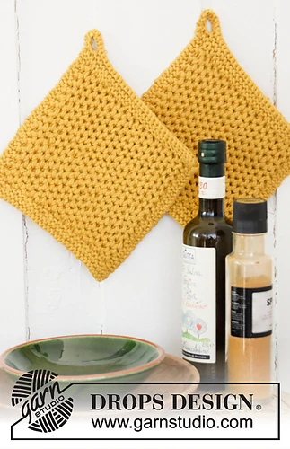 textured knit potholders hanging in kitchen