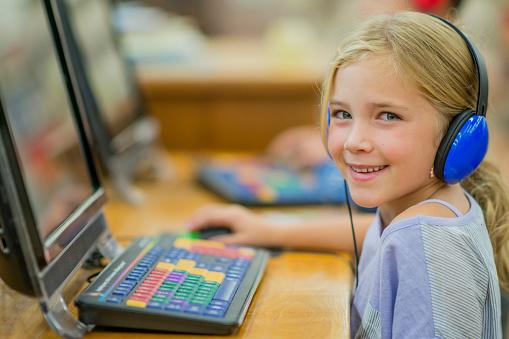 A young child wearing headphones

Description automatically generated with medium confidence
