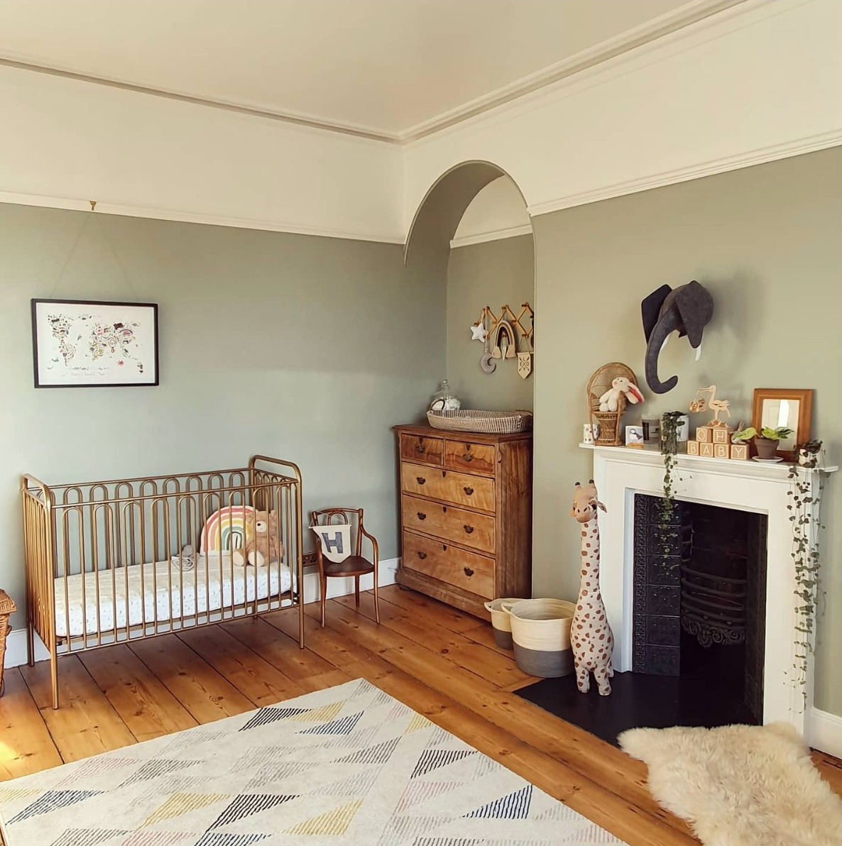 Nursery with walls painted in Mizzle by Farrow and Ball