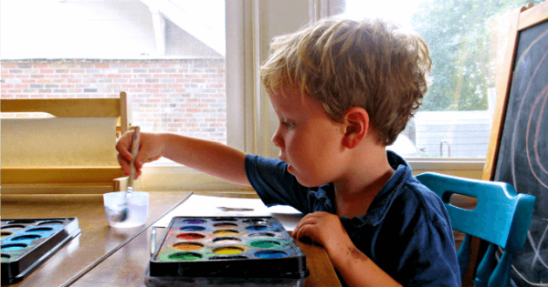 A child painting with watercolors 