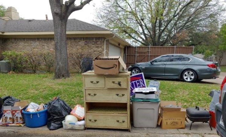 Damaged goods sitting on a home’s curbside, waiting to be picked up