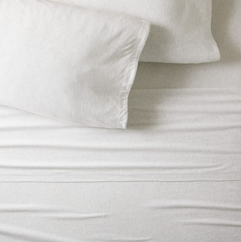 Off-white cotton sheets and pillows