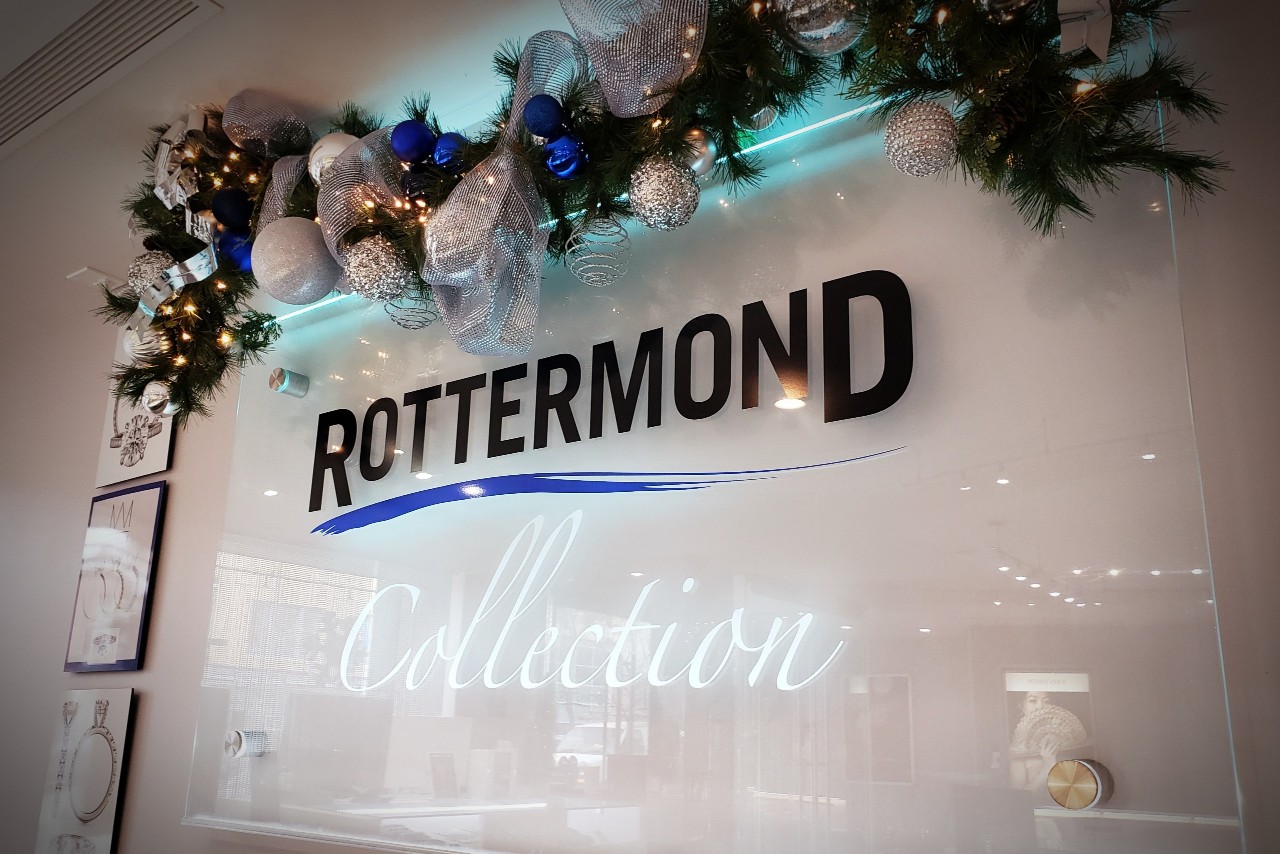 Rottermond Jewelers sign decorated with white and blue garland