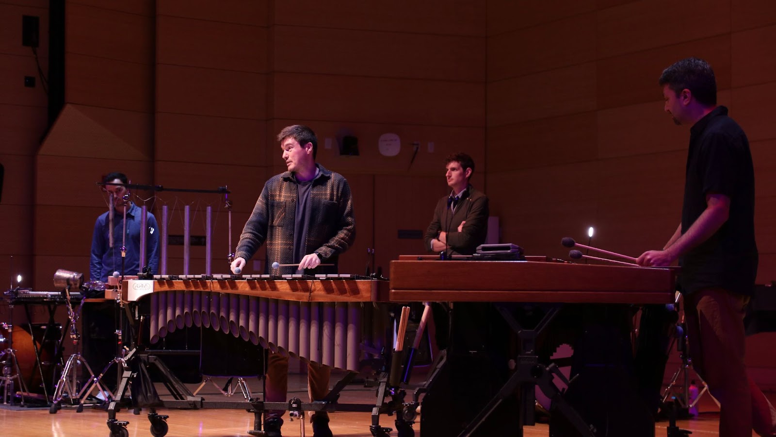 All four members of the ensemble demonstrating on their instruments during their interactive seminar on Wednesday in the Tishman auditorium.