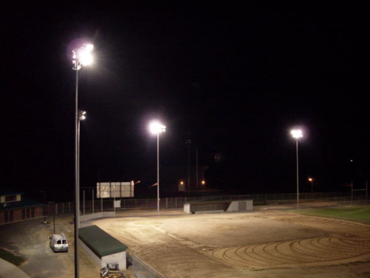 Diagram showcasing a lighting fixture emitting light onto a baseball field.