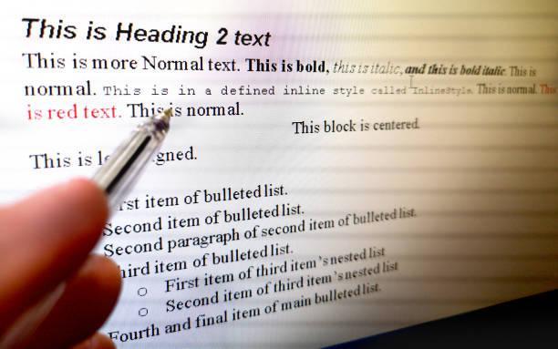 hand with pen indicate text formatting rules on word processor software on computer screen hand with pen indicate text formatting rules on word processor software on computer screen . formatting and publishing\ stock pictures, royalty-free photos & images