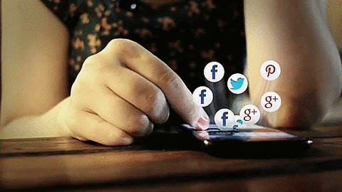 types of digital advertising: woman scrolling through social media on her phone