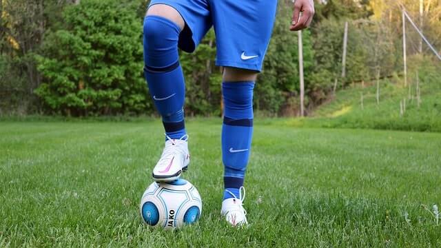Do soccer shin guards go under socks?