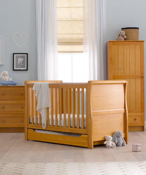 Take sides off the cot bed by removing one side first and transitioning your infant