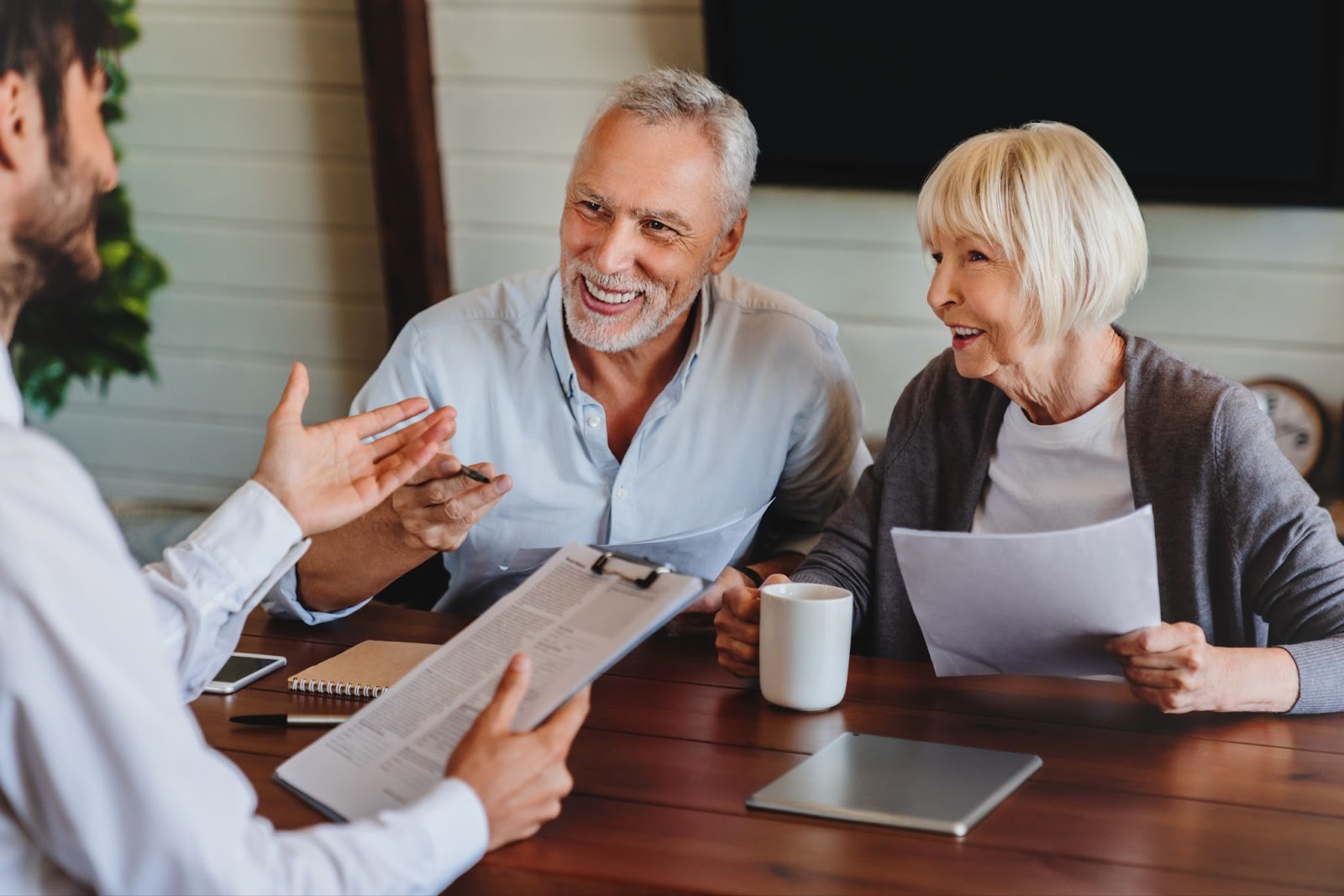 older couple talking to an agent