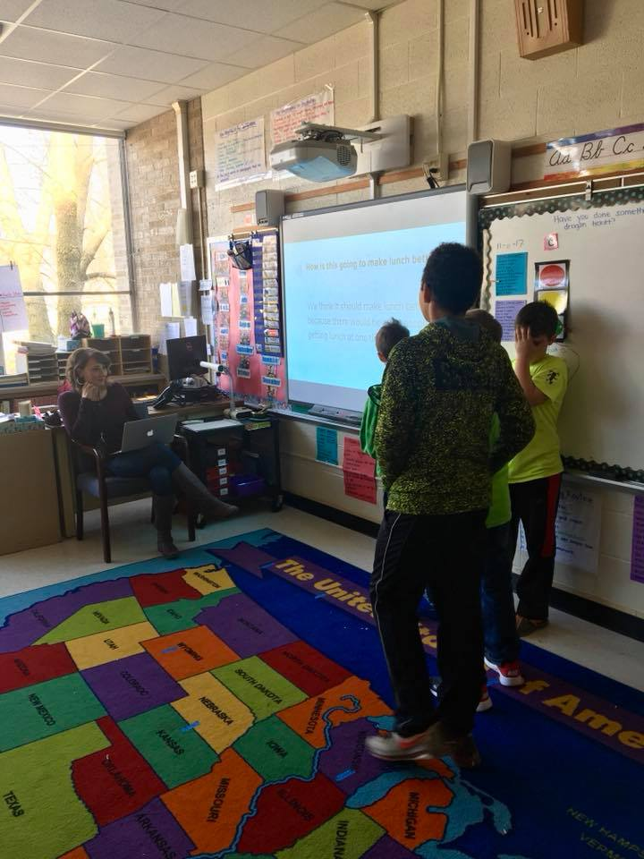 Young students engage in classroom activity. 